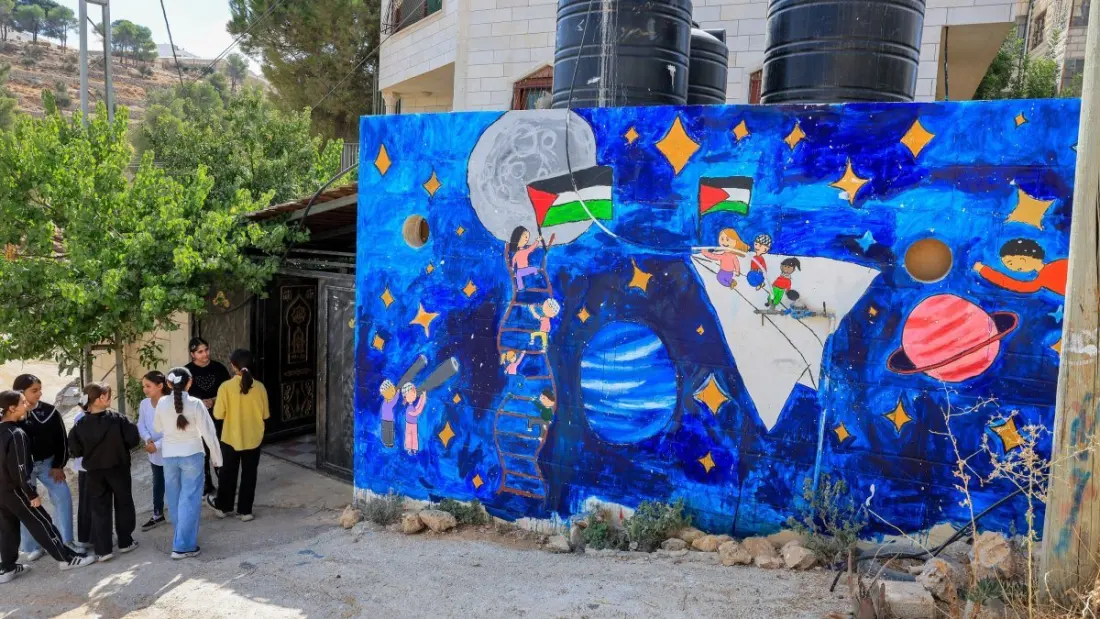In a divided Hebron neighbourhood, 600 children paint their way past the checkpoints